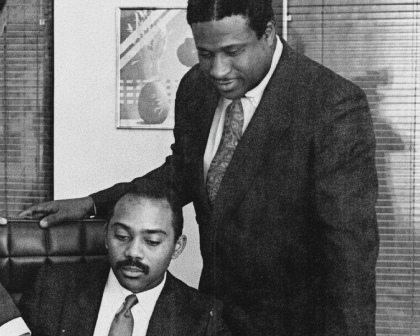 UTRS founders Lamont McLean (seated) and Gerry Wright (right), with Lloyd Booker, UTRS VP of Technical Services, in 1987. Photograph enhanced with AI for optimal presentation