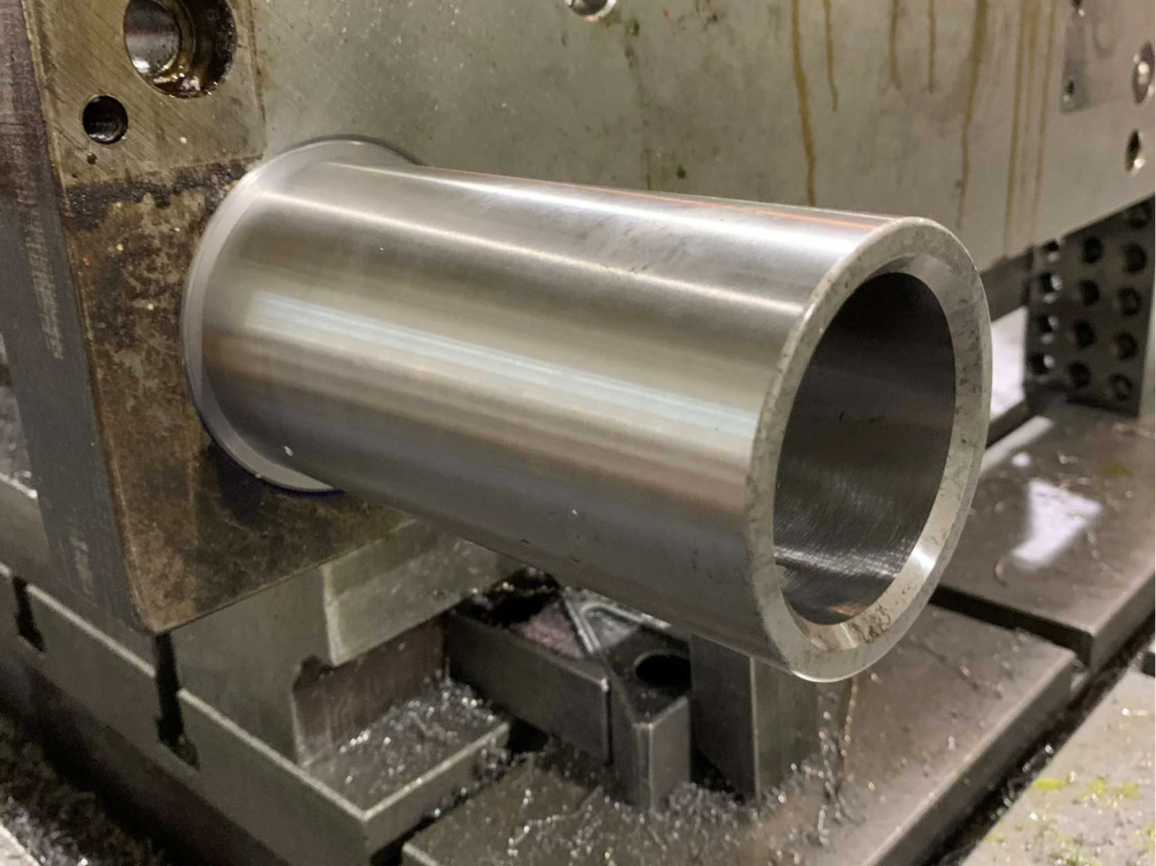 New guide bushing installed in a 4-ft wide by 8-ft long by 2-inches thick progress die set piece that weighs about 3,000 pounds.