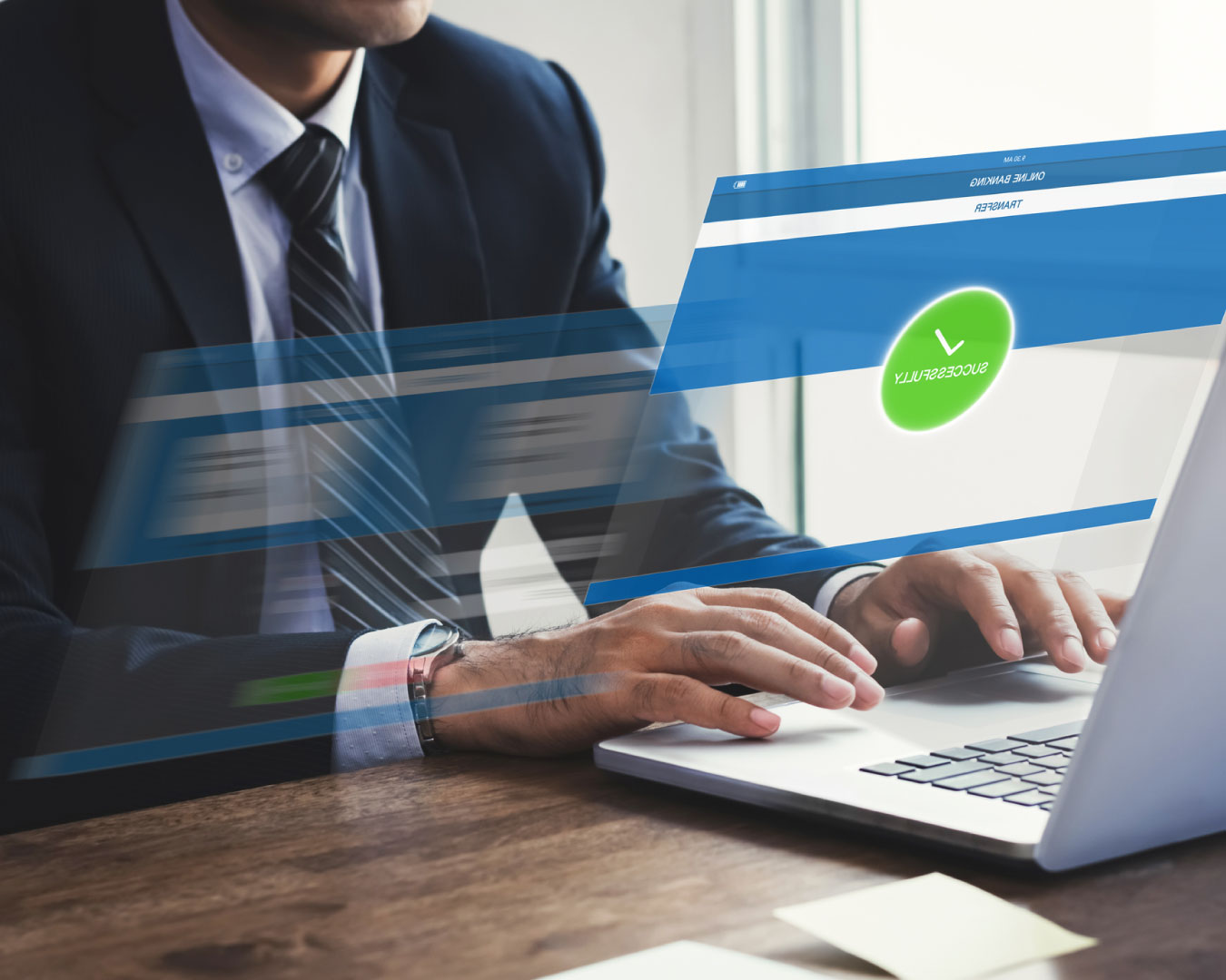 Businessman successfully transferring money with internet online e-banking on laptop computer with virtual screen effect