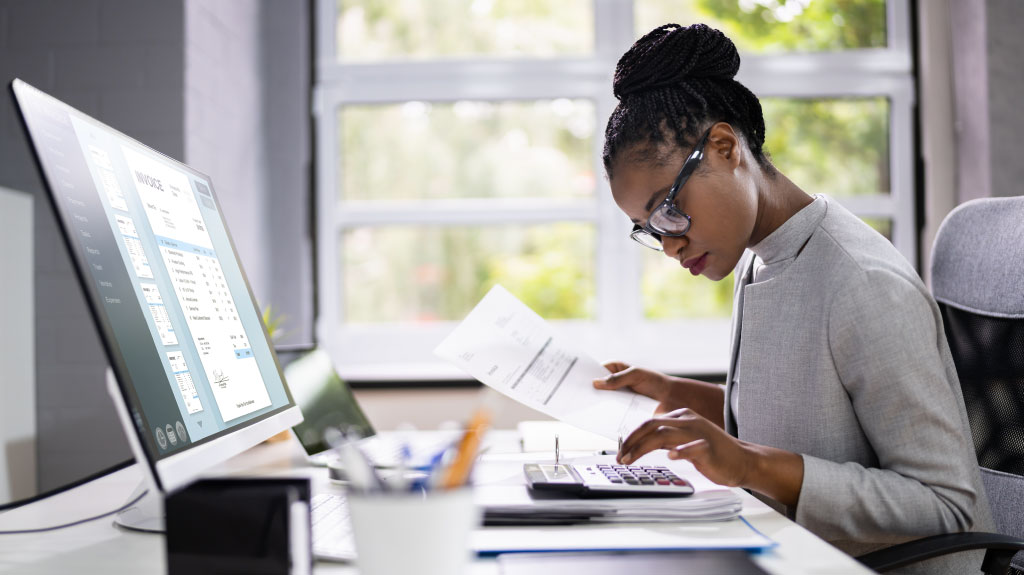 Accountant Using and Examining Accounts by Electronic Invoice Or Bill